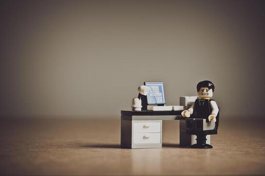 stressed out worker at their desk (lego figure dramatization)
